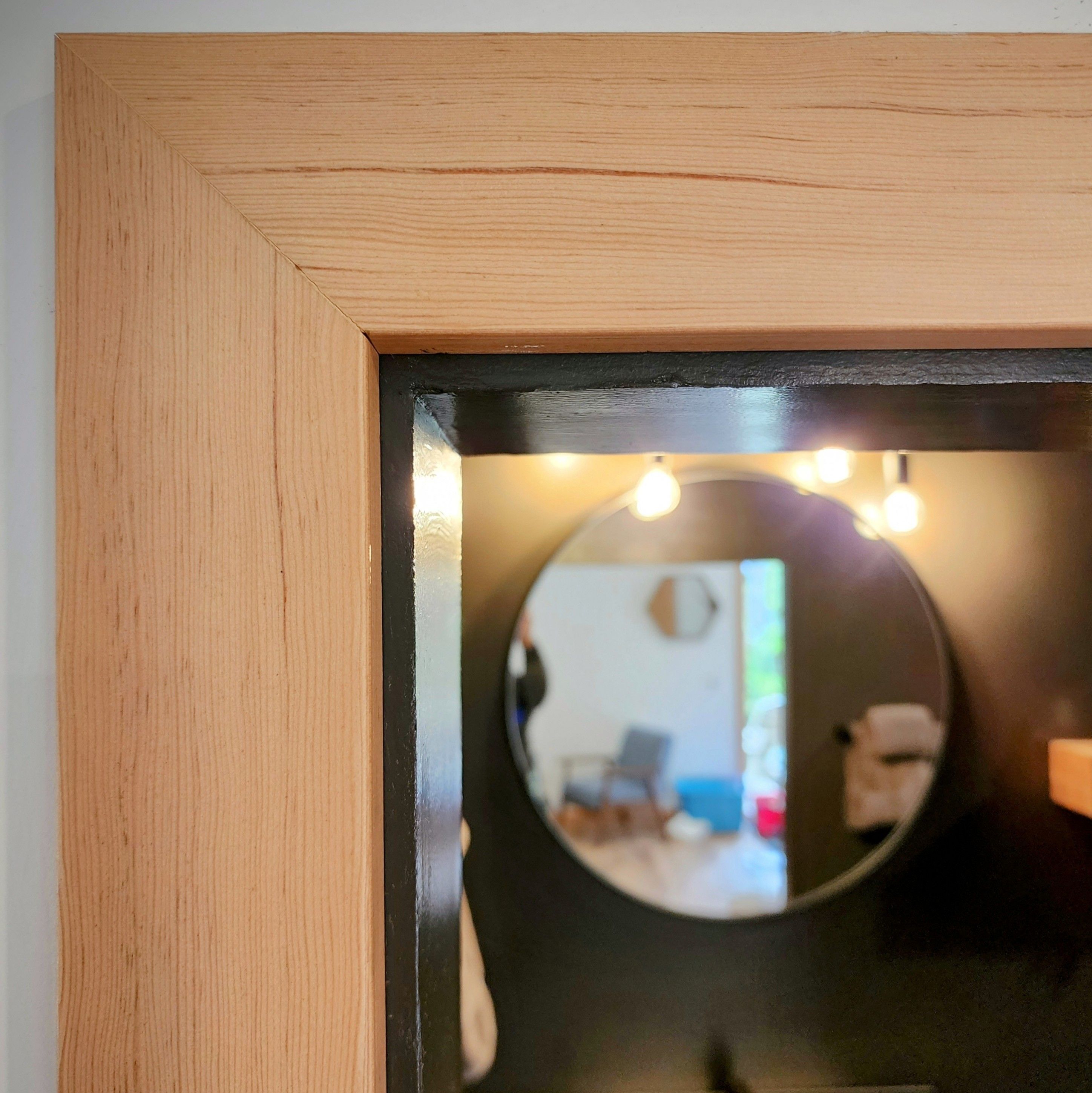 Fir door casing with a mitred corner, in a converted garage suite in Ucluelet.